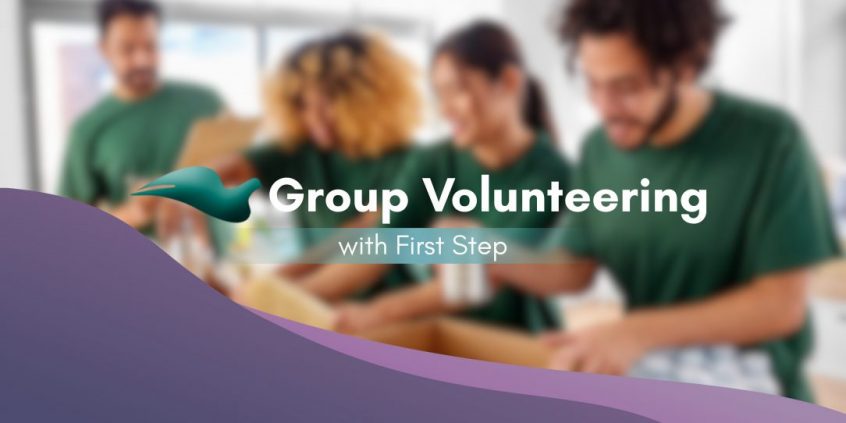 Banner that reads "Group Volunteering with First Step" with a blurred image of volunteers packaging food in the background